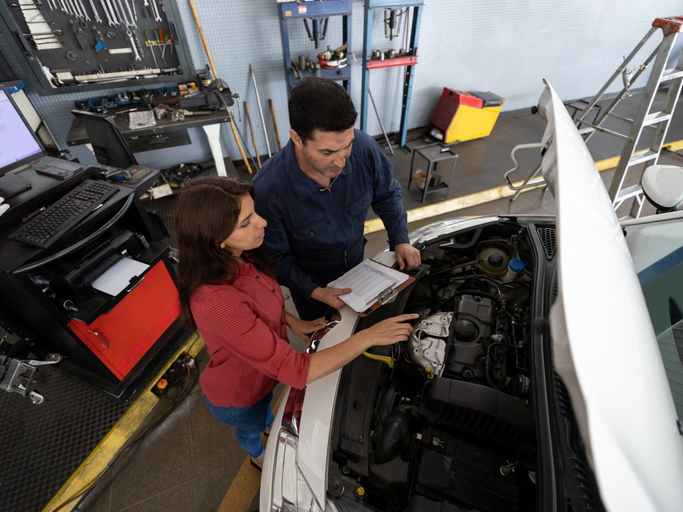 Mechanic speaking with a customer